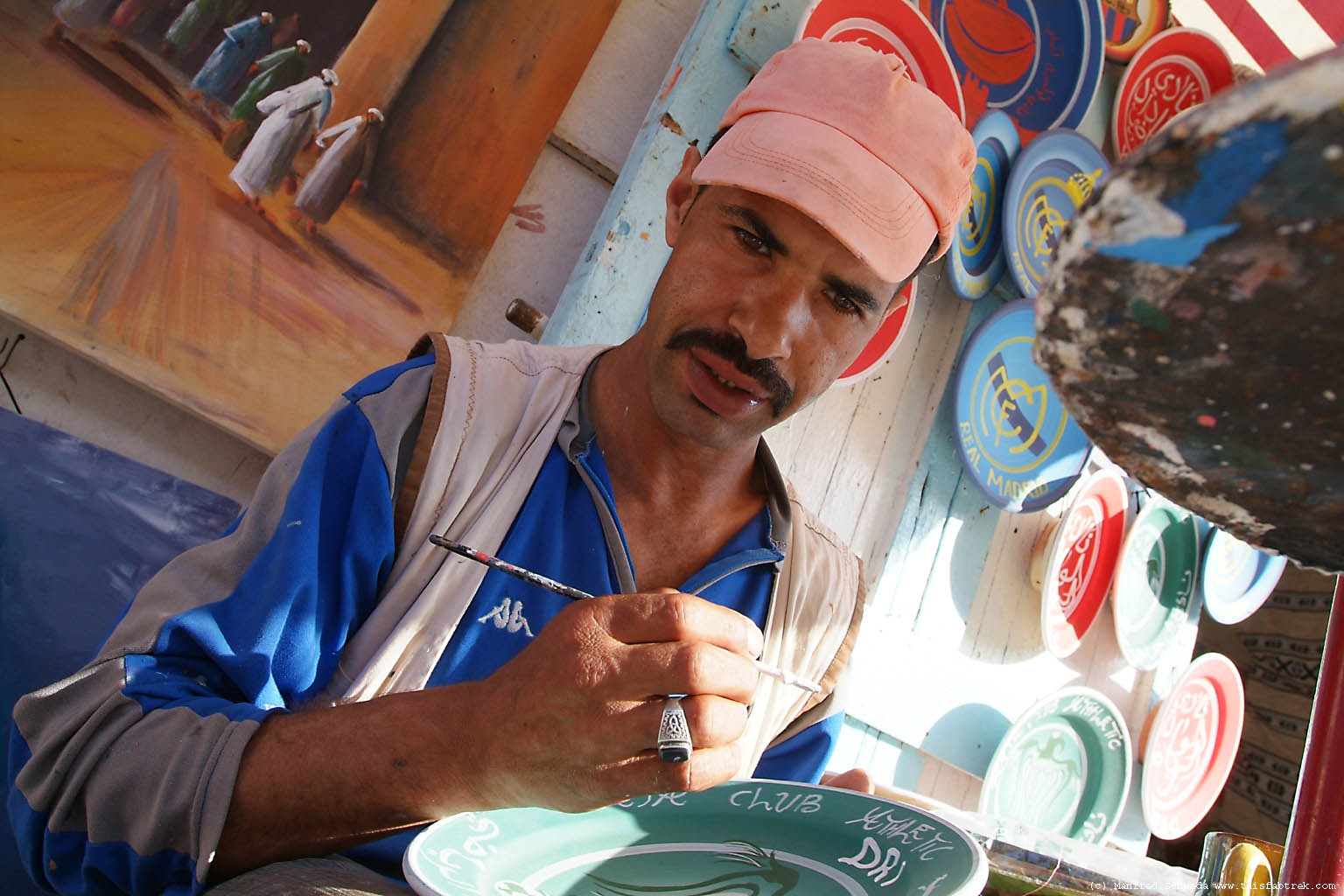 man-painting-pottery